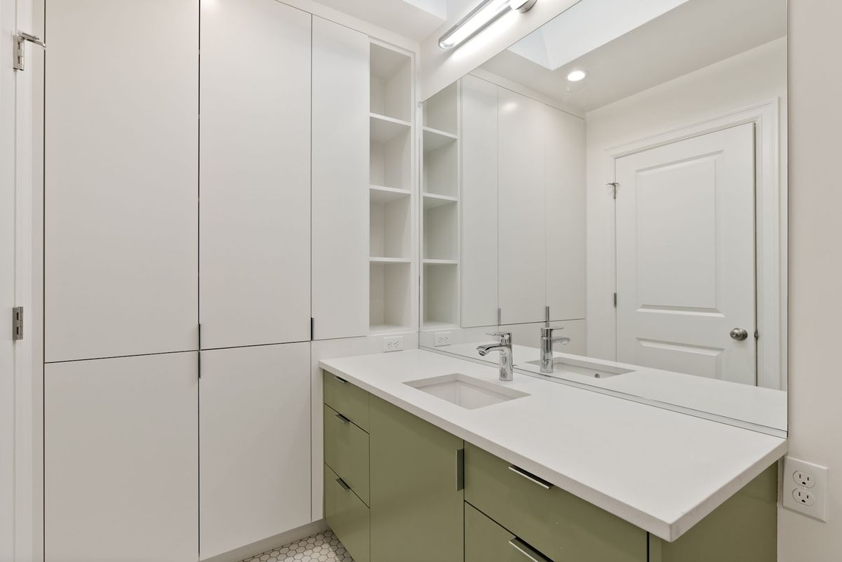 New bathroom: sage vanity, Caesarstone counter, skylight above